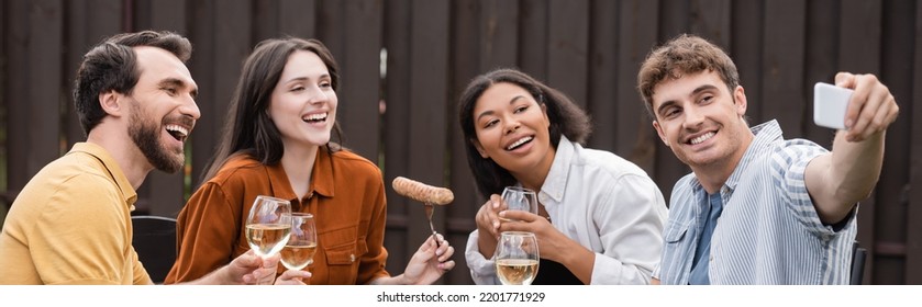 Cheerful Multiethnic Friends Taking Selfie During Bbq Party In Backyard , Banner