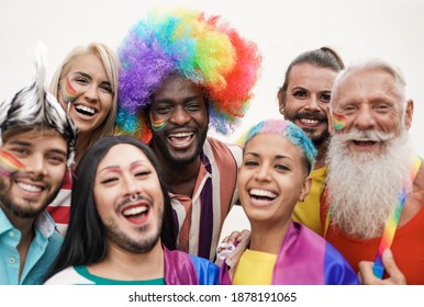 Cheerful multiracial people from different generations at gay pride parade - Concept of lgbt and homosexual love