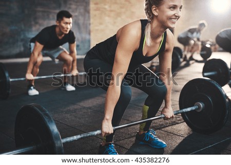 Similar – Foto Bild Langhantel mit Gewichten in einem Fitnessstudio