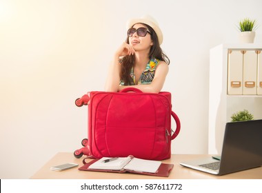 Cheerful Office Worker With Luggage And Sunglasses Ready For Long Vacation Holiday. Mixed Race Asian Chinese Model.