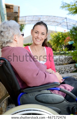 Similar – Senior dissatisfied woman in a wheelchair with her daughter