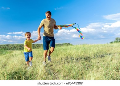 Cheerful parent having playtime with his son