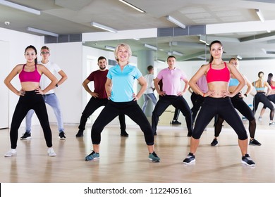 Cheerful People Of Different Ages Studying Zumba Dance Elements In Dancing Class