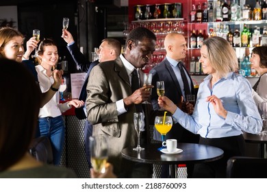 Cheerful Positive Glad Smiling African Businessman Having Fun With Mature Female Coworker During Office Party At Nightclub