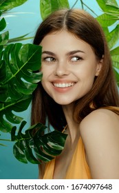 Cheerful pretty woman charm smile palm leaves - Shutterstock ID 1674097648