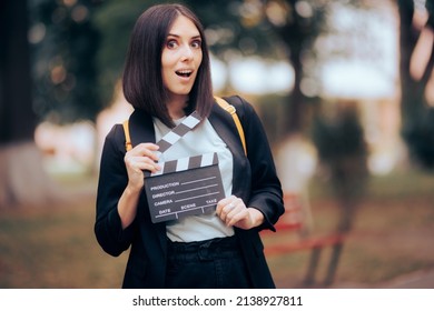 
Cheerful Professional Actress Ready To Audition For Lead Role. Happy Casting Director Holding A Film Slate
