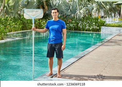 Cheerful Professional Swimming Pool Cleaner Posing With Plastic Skimmer