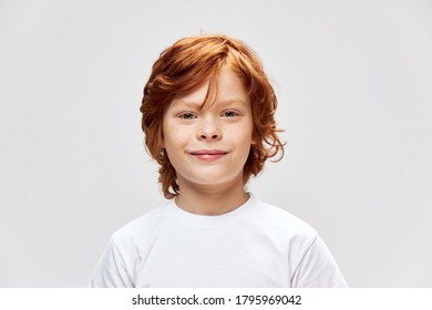 Cheerful Redhead Child White T-shirt Smile Studio Gray Isolated 