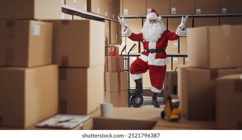 Cheerful Santa Claus working in the warehouse, he is delivering Christmas gifts - Powered by Shutterstock