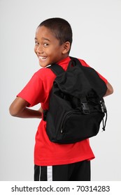 Cheerful School Boy Looking Back Over His Shoulder