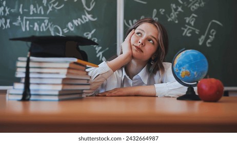 A cheerful schoolgirl daydreaming in the background of school subjects. - Powered by Shutterstock