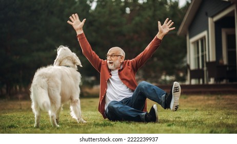 Cheerful Senior Man Enjoying Time Outside with a Pet Dog, Petting a Playful White Golden Retriever. Happy Adult Man Enjoying Leisure Time on a Front Yard in Front of the House. - Powered by Shutterstock