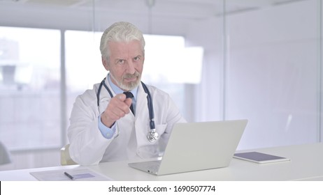 Cheerful Senior Old Doctor Pointing Finger At Camera