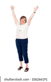 Cheerful Senior Woman Lifting Her Arms Up Filled With Joy