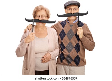 Cheerful Seniors With Big Fake Moustaches Isolated On White Background