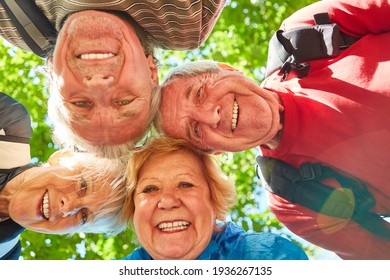 Cheerful Seniors Hiking Group In Nature In Summer