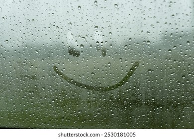 A cheerful smile is playfully etched on a fogged-up window, as rain taps against the glass, transforming an ordinary day into a moment of delight. - Powered by Shutterstock