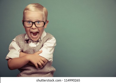 Cheerful smiling boy on a green background. - Powered by Shutterstock