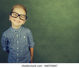 Cheerful Smiling Boy On A Green Background.