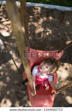 Similar – Image, Stock Photo Little girl climbing to a wooden observation tower in a wetland