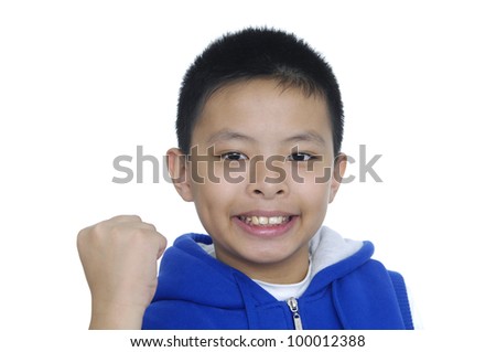 cheerful smiling little boy raised his hands up. shooting in the studio