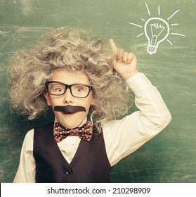  Cheerful Smiling Little Kid (boy) Against Chalkboard. Looking At Camera. Little Einstein Style. School Concept