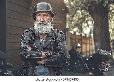 Cheerful Smiling Old Man In Helmet