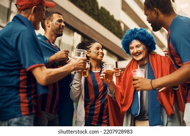 Cheerful Soccer Fans Drinking Beer While Celebrating Victory Of Their Team On The Street. 