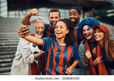 Cheerful Sports Fans Having Fun While Taking Selfie During The World Cup. 