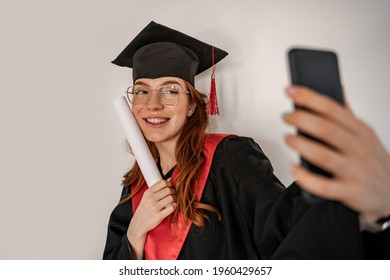 Cheerful Student In Graduation Cap And Gown Taking Selfie, Senior 2021