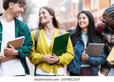 Cheerful students having fun together laughing after university lectures - Powered by Shutterstock