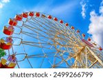 Cheerful sunny view of Ferris Wheel in Central Children