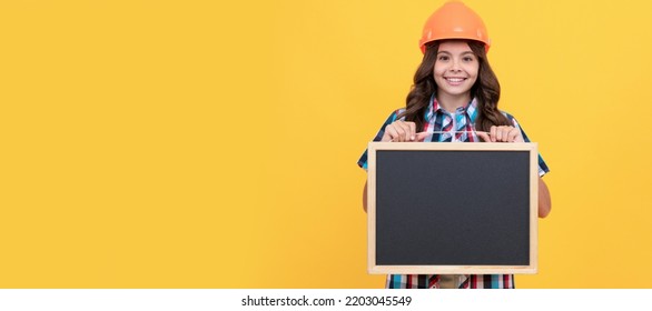 Cheerful Teen Girl Laborer Hold Blackboard. Child Advertising Labor Day. Child Builder In Helmet Horizontal Poster Design. Banner Header, Copy Space.