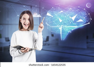 Cheerful teen girl with notebook standing in blurry office with double exposure of futuristic creative brain hologram. Concept of brainstorming and artificial intelligence. Toned image - Powered by Shutterstock