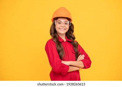 Cheerful Teen Girl Wear Eyeglasses And Helmet. Kid Future Engineer On Yellow Background. Safety Glasses For Repairing. Labor Day. Smiling Kid In Protective Glasses. Childhood Development.