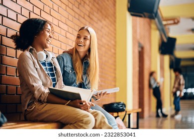 Cheerful teenage girl having fun while studying in high school hallway. - Powered by Shutterstock