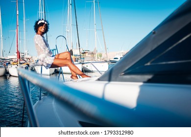 Cheerful Tourist Sit Down And Smile Enjoying The Summer Holiday Vacation On A Boat - Black Happy Beautiful Black Young Woman Enjoy The Travel Lifestyle And Sun In Outdoor Tourism Activity