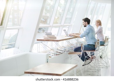 Cheerful two students are studying with computers - Shutterstock ID 416888236