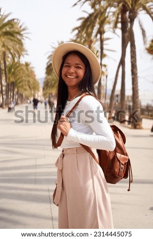 Similar – Image, Stock Photo smiling woman with backpack. freedom