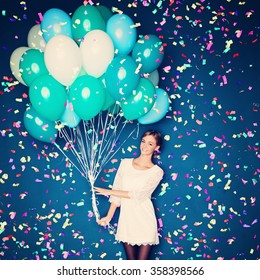 Cheerful Woman With  Balloons And Confetti On Blue Background