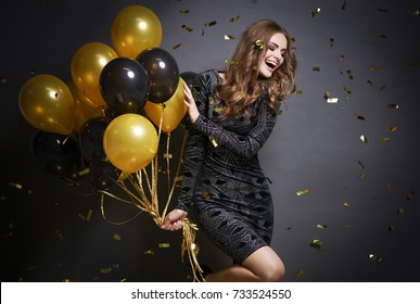 Cheerful Woman With Balloons Laughing 
