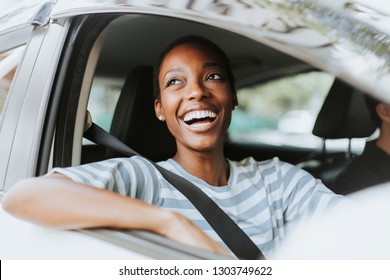 Cheerful Woman In A Car