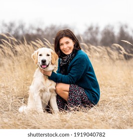 Cheerful Woman With Devoted Dog In Early Spring Nature