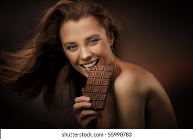 Cheerful Woman Eating Chocolate