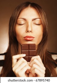 Cheerful Woman Eating Chocolate