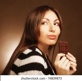 Cheerful Woman Eating Chocolate