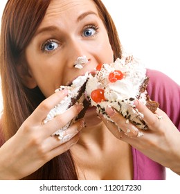 Cheerful woman eating pie, isolated over white background