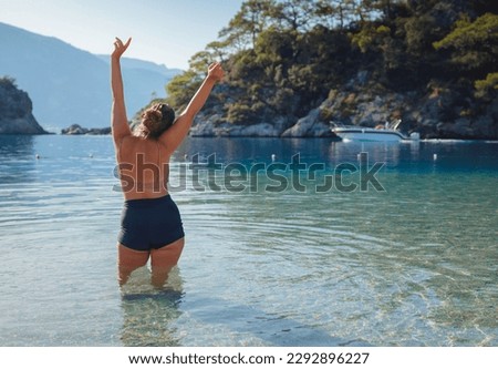 Cheerful woman enjoying the beach Oludeniz Blue Lagoon Turkey. Life of people xl size, happy nice natural beauty woman
