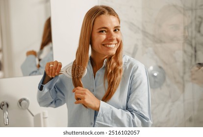 A cheerful woman enjoys her hair care routine, beautifully showcasing the essence of beauty and selfcare - Powered by Shutterstock