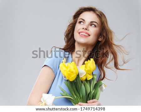 Cheerful woman flowers decorating gift Women's Day